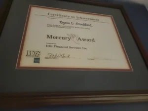 Mercury Award certificate of achievement presented to Byron L. Studdard by IDS Financial Services